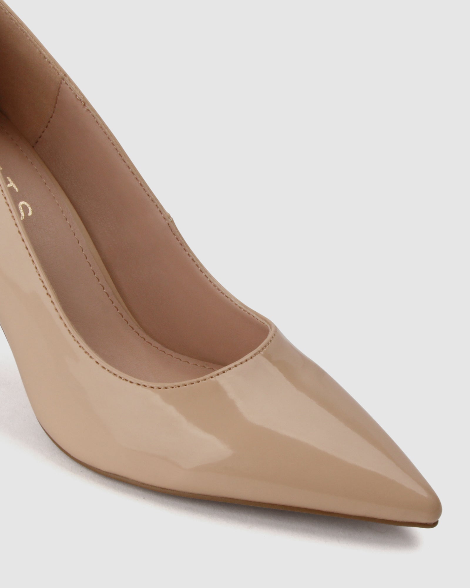 Nude patent clearance pointed heels